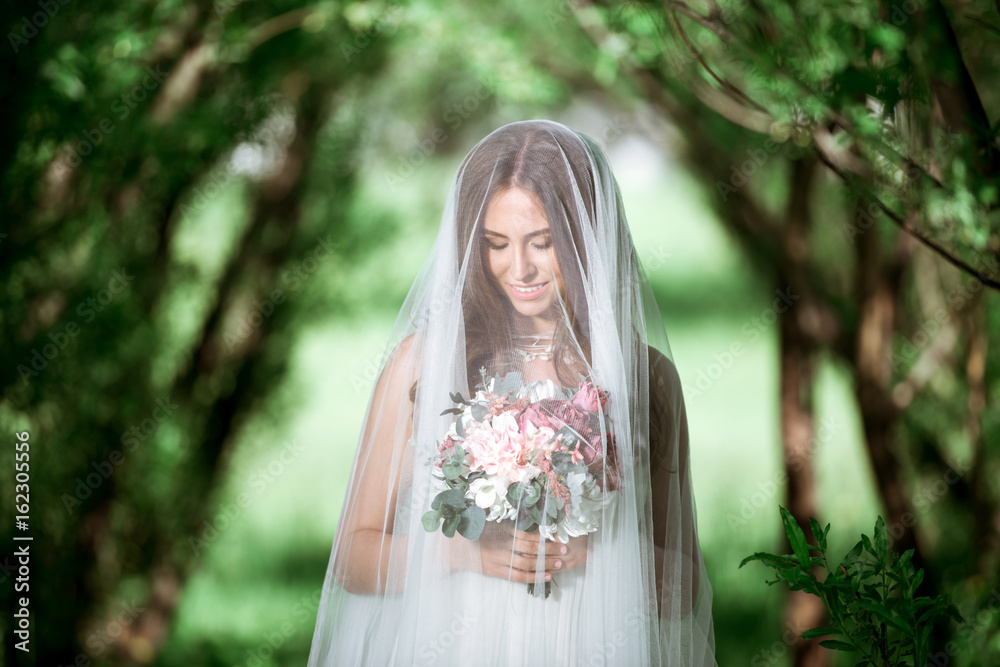 Brunette bride in fashion white wedding dress with makeup Brunette bride in fashion white wedding dress with makeup