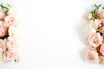 Flower border frame made of beige roses on white background. Flat lay, top view. Floral texture background.