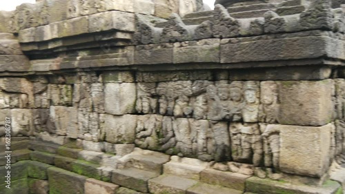 Wallpaper Mural Tilt up to a buddha statue at the Borobudur a 9th-century Mahayana Buddhist Temple in Magelang, Central Java, Indonesia Torontodigital.ca
