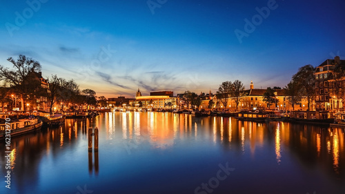 Photography The most famous canals and embankments of Amsterdam city during sunset
