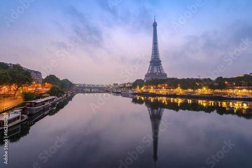 Paris city skyline with Eiffel Tower and Seine River when sunrise, Paris, France © Noppasinw