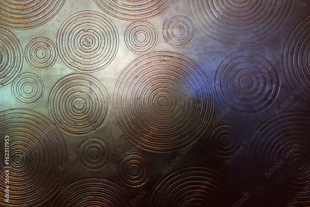 Abstract of Wood Craving wall in circle around many ripple patter and reflect with lighting so light and shadow in gold silver and fade