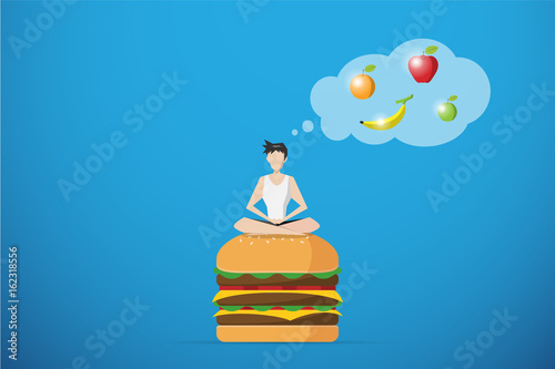 healthy man meditating on hamburger and thinking of fruit, diet and health concept