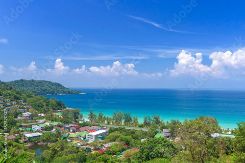 Tropical beach landscape with beautiful turquoise ocean waives and sandy coastline from high view point. Kata and Karon beaches, Phuket, Thailand