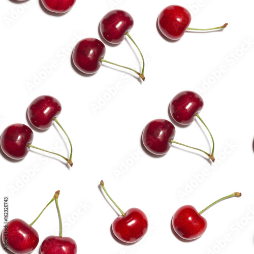 seamless pattern of red shiny sweet cherry berries