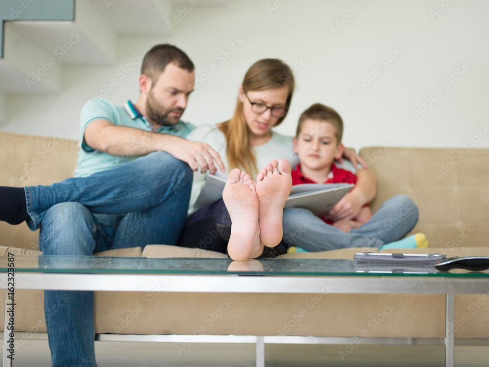 family with little boy enjoys in the modern living room family with little boy enjoys in the modern living room
