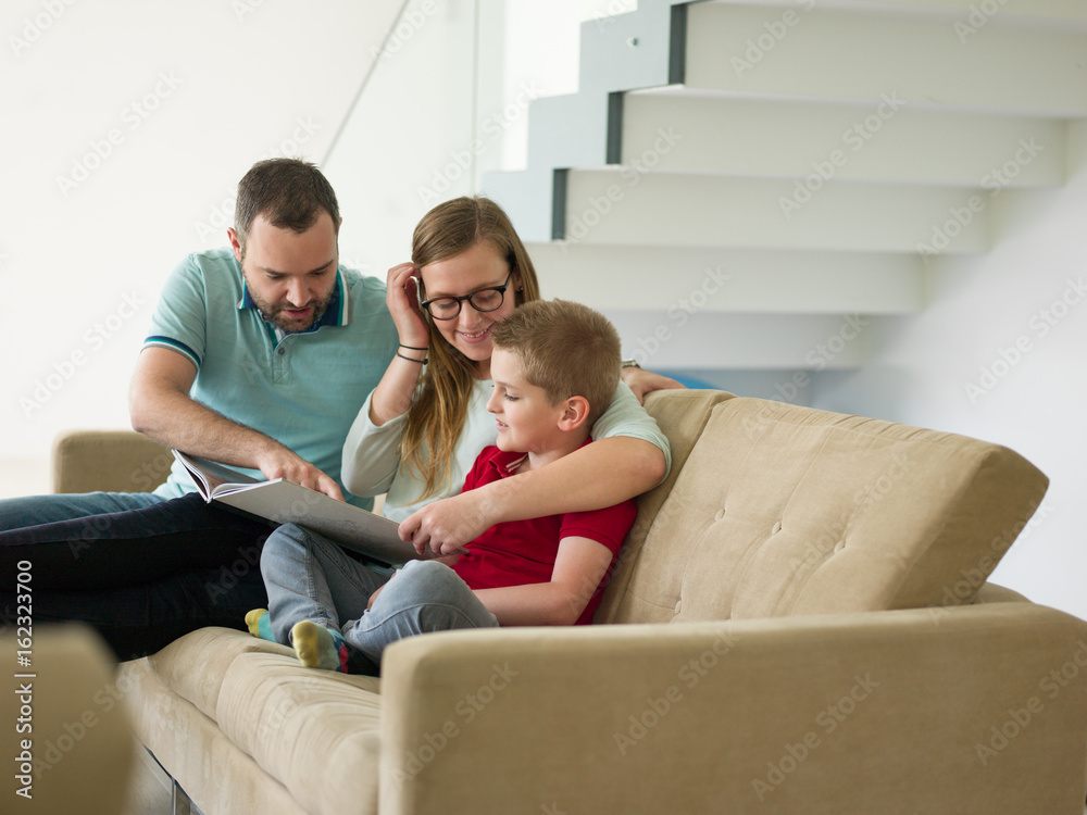 family with little boy enjoys in the modern living room family with little boy enjoys in the modern living room