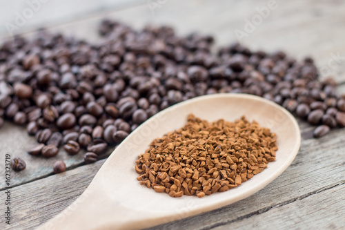Cup and coffee beans on wooden