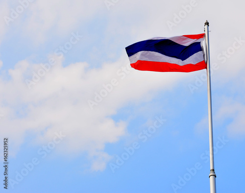 The National Flag of Thailand on blue sky background