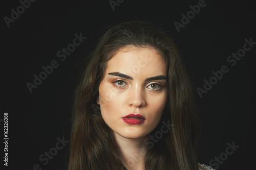 stylish girl retro portrait on a dark background .