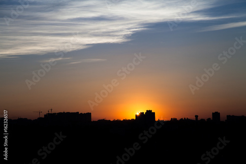 Sunset in the city beyond the horizon from the height © ripman05