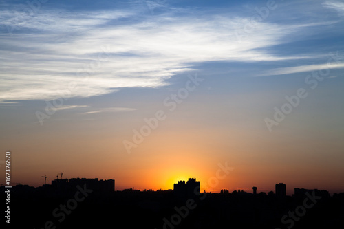 Sunset in the city beyond the horizon from the height © ripman05