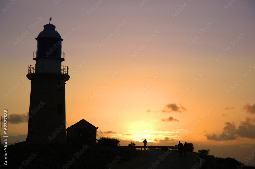 Lighthouse silhouette at dusk
