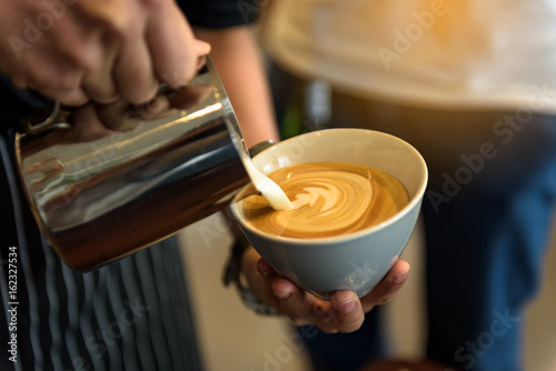 Coffee latte art in coffee shop photo