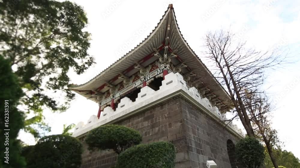 Taipei South Gate in Taiwan. View from below. This gate is also known as the Lizheng Gate or simply Nanmen. It is a sunny day with clouds. Taipei South Gate in Taiwan. View from below. This gate is also known as the Lizheng Gate or simply Nanmen. It is a sunny day with clouds.