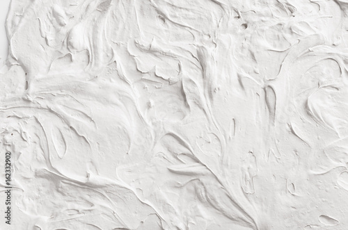 White decorative abstract plaster texture with waves and surf. photo