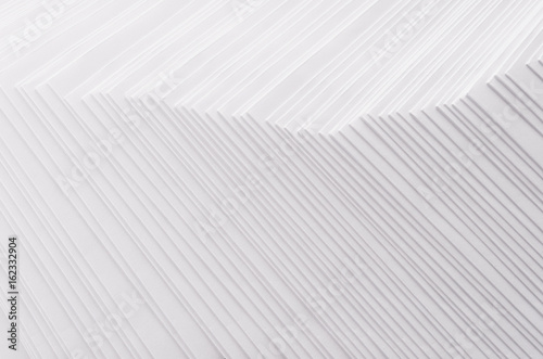 White striped stepped abstract texture with halftone border.