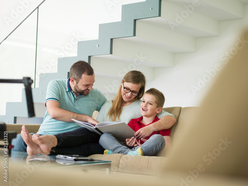 family with little boy enjoys in the modern living room