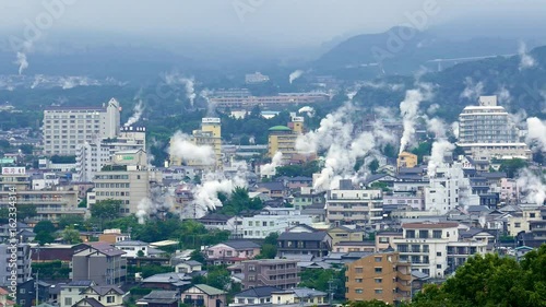 Beppu, Japan cityscape with hot spring bath houses photo