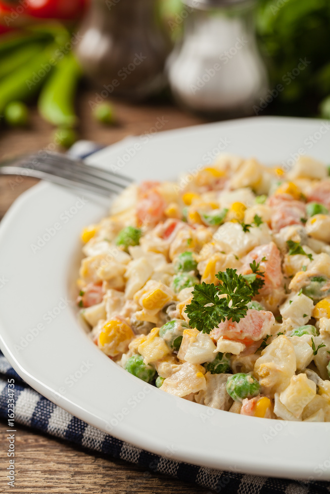 Traditional salad with cooked vegetables with mayonnaise. Traditional salad with cooked vegetables with mayonnaise.