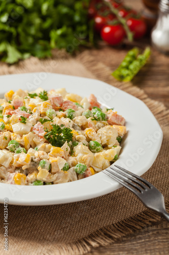 Traditional salad with cooked vegetables with mayonnaise.