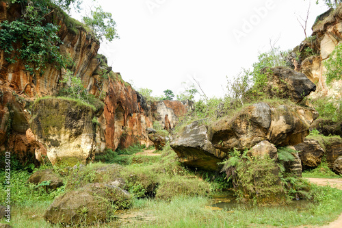 The exploitation of limestone hills canyon forming a unique architectural in Arosbaya Hill Madura Island, Indonesia