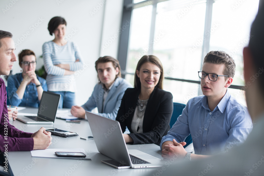 Business Team At A Meeting at modern office building Business Team At A Meeting at modern office building