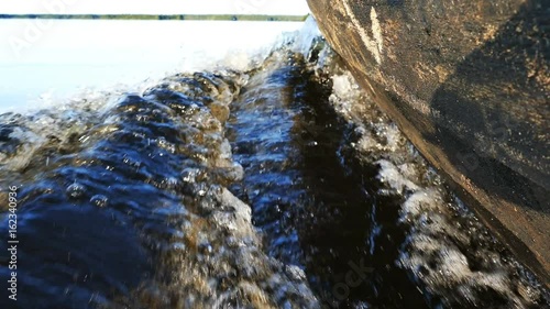 Rippling Water Trace Near Boat Motor photo