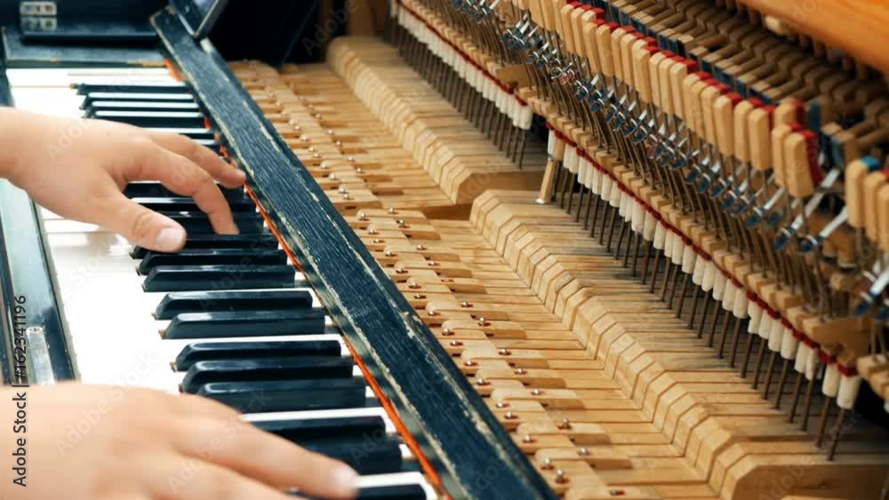 Two male hands playing the old piano. Close Up view. Two male hands playing the old piano. Close Up view.