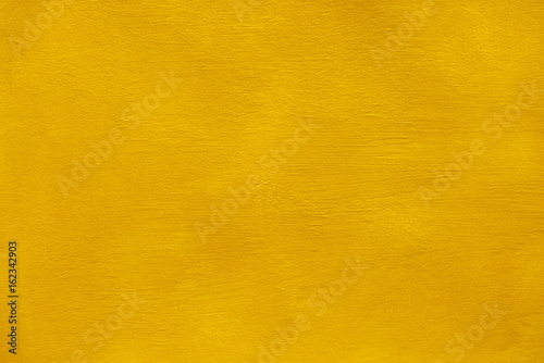Golden hand painted texture background with brush strokes