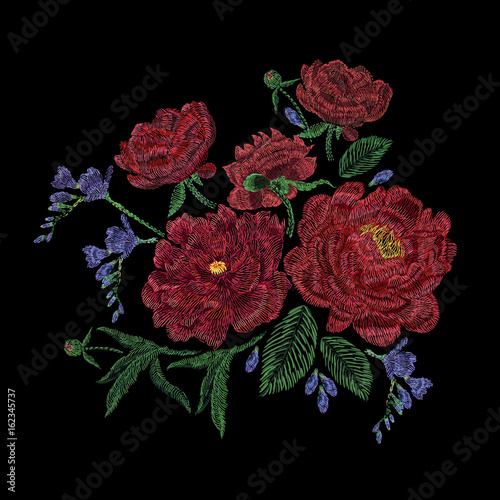 Embroidered composition with peonies, wild and garden flowers, buds and leaves. Satin stitch embroidery, floral design on black background. Folk line trendy pattern for clothes, dress, fabric, decor.