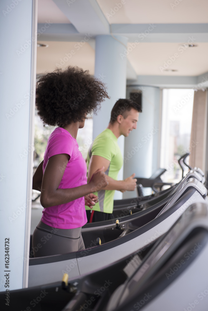 people exercisinng a cardio on treadmill in gym people exercisinng a cardio on treadmill in gym