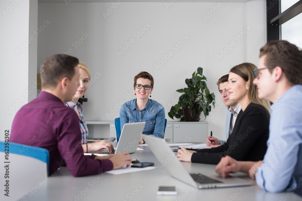 Business Team At A Meeting at modern office building Business Team At A Meeting at modern office building