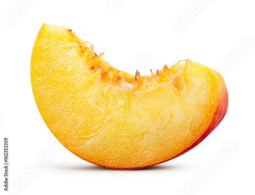 Peach. Peach slice isolated on white. With clipping path.