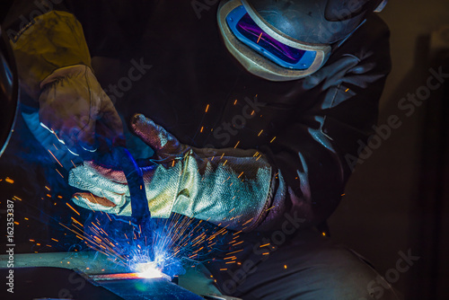 Industrial steel welder in factory