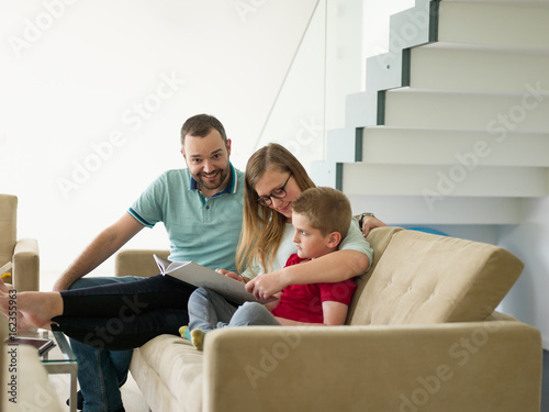 family with little boy enjoys in the modern living room