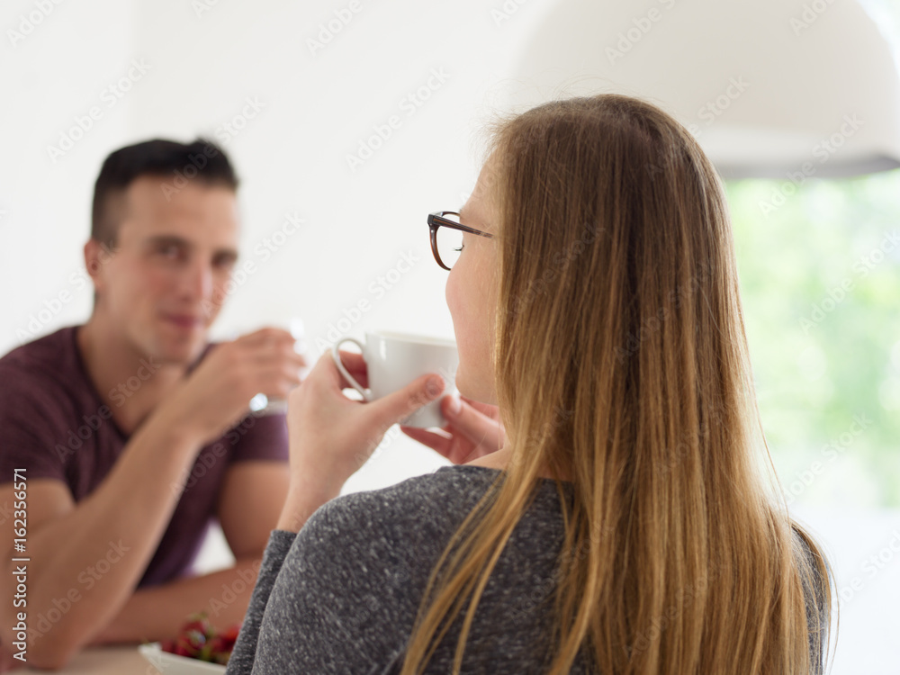 couple enjoying morning coffee and strawberries couple enjoying morning coffee and strawberries