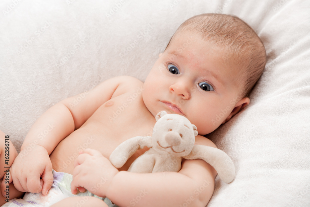 the little baby with a toy the little baby with a toy