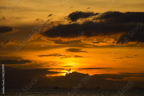 Wonderful dramatic sunset over the sea water , Thailand