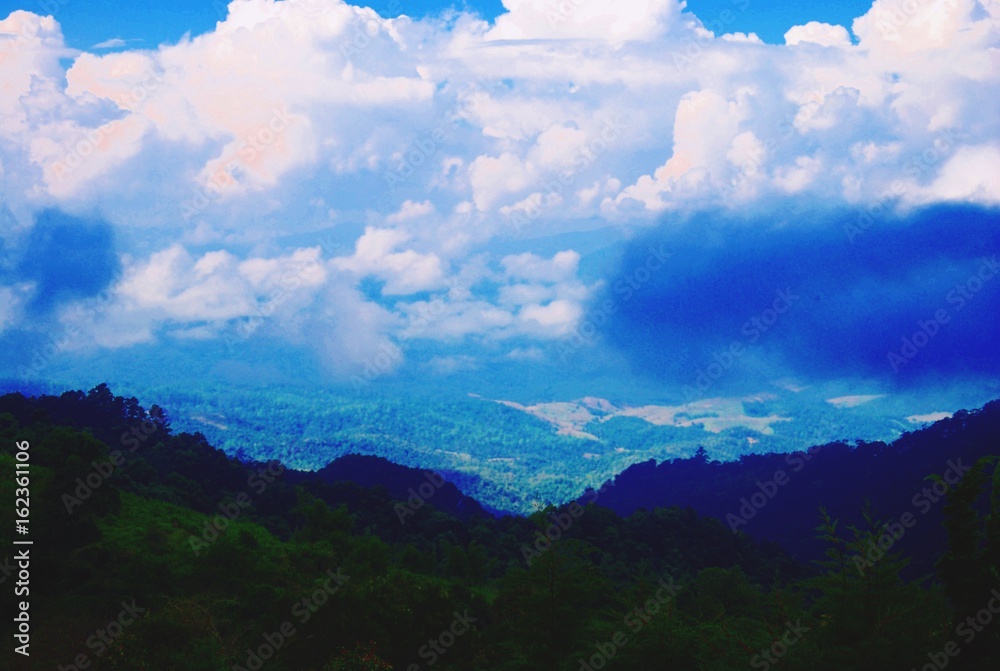 Beautiful mountains landscape and sky with clouds for background.