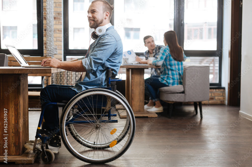Intelligent handicapped student studying in a public place