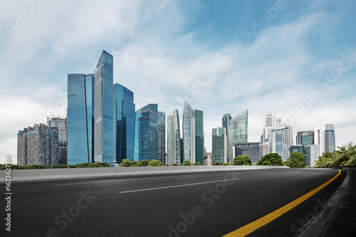 Canvas Print empty road with modern buildings