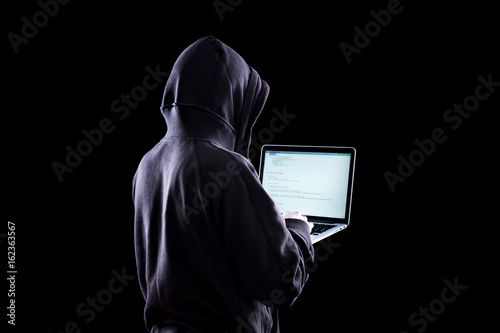 Anonymous hacker in the dark