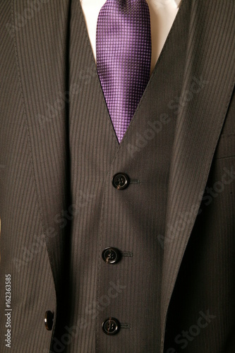 close up of man in a suit with tie and handkerchief