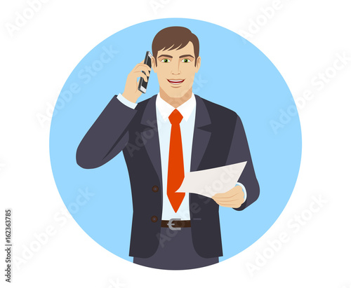  Businessman with paper talking on the mobile phone