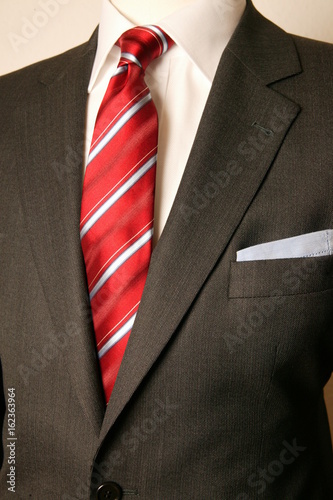 close up of man in a suit with tie and handkerchief