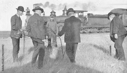 Water dowser and steam train  1907.. Date: 1907