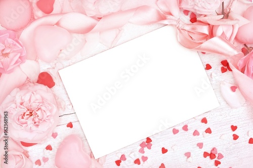 Empty card copy space on pastel pink valentine decor background, soft heart frame, toned