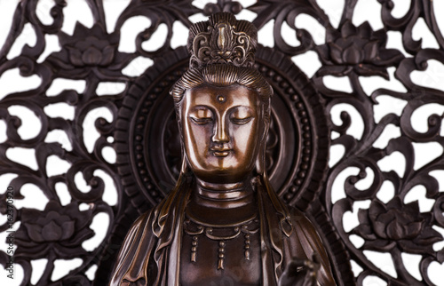 The face of Bodhisattva Guan Yin - the deity acting mainly in a female appearance, saving people from disasters; giver of children, patroness of female half of the house. 