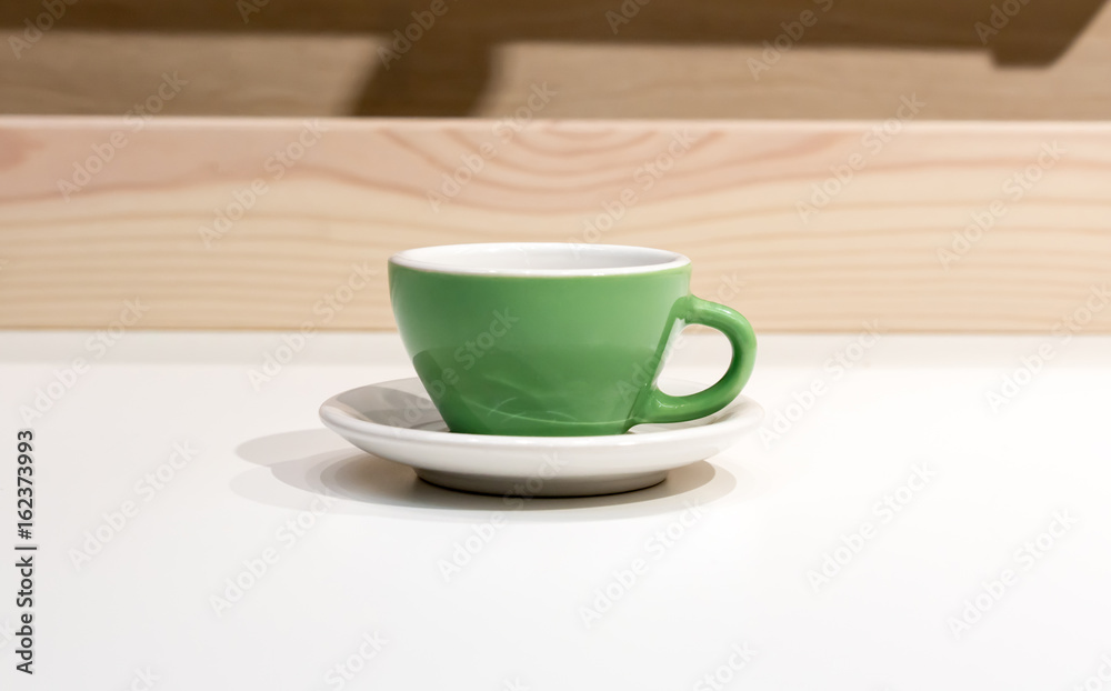 Empty green coffee or tea mug